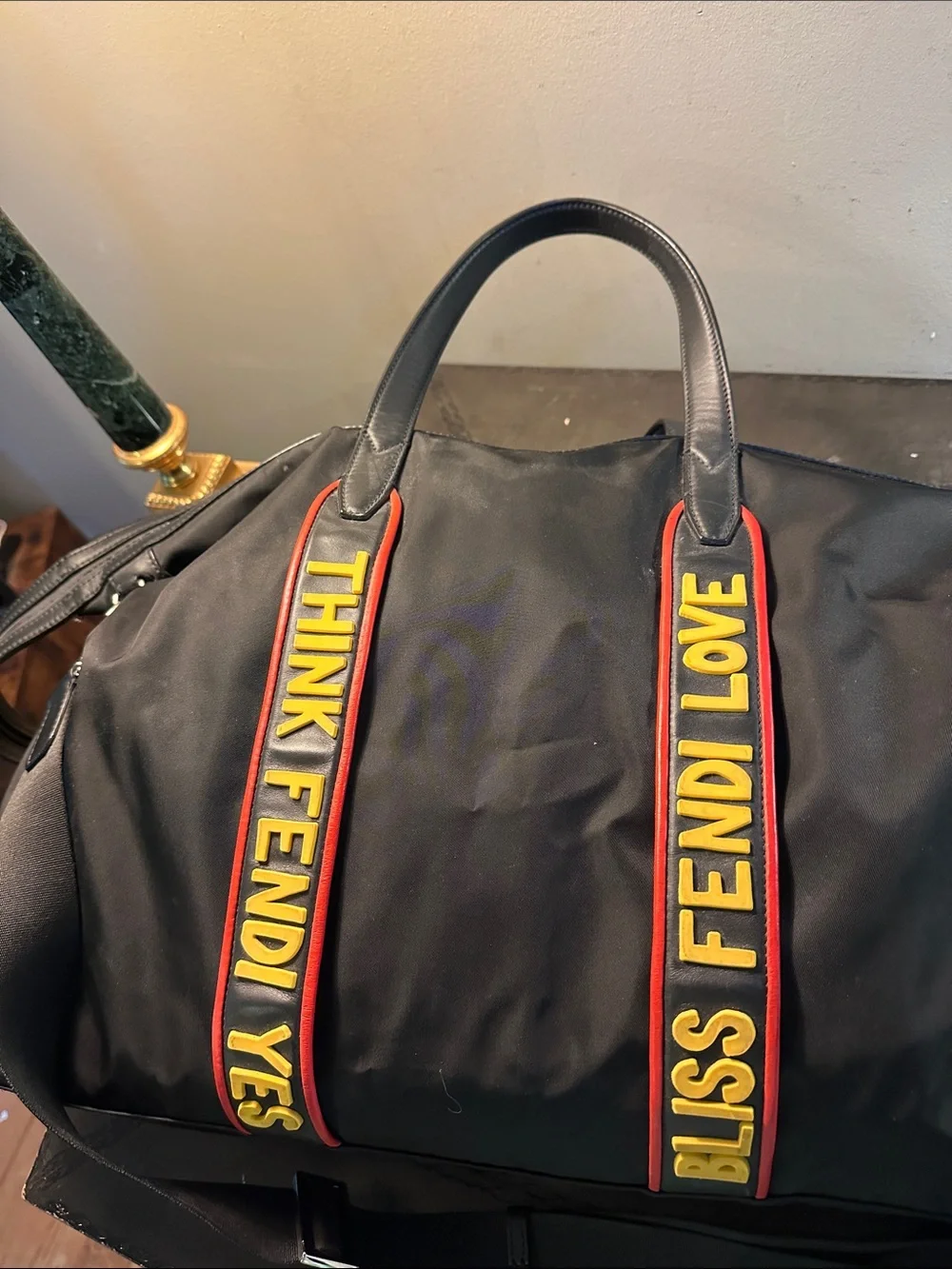 Fendi Black Duffel Bag with Yellow and Red Logo Straps